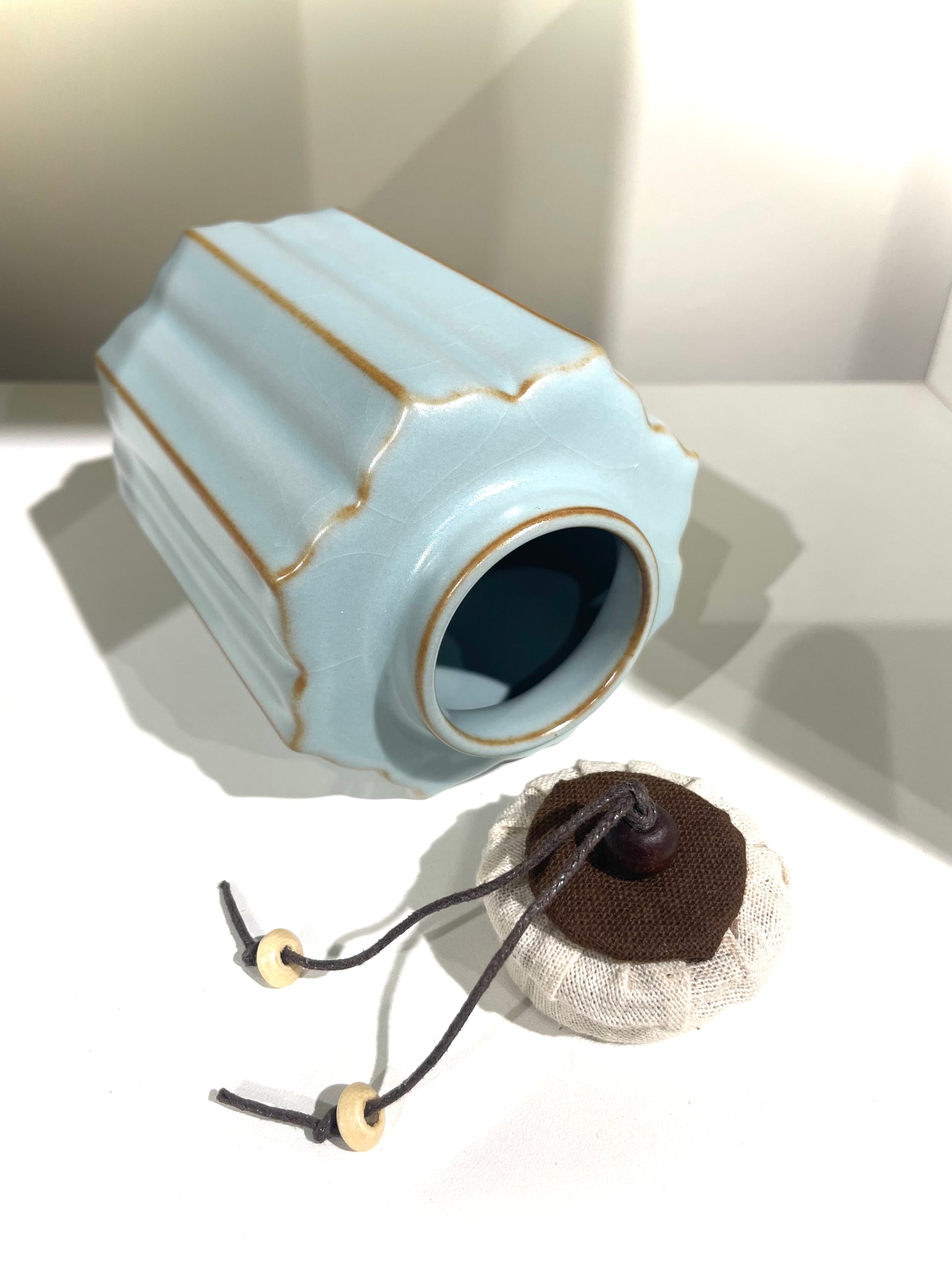 celadon tea caddy with lid opened